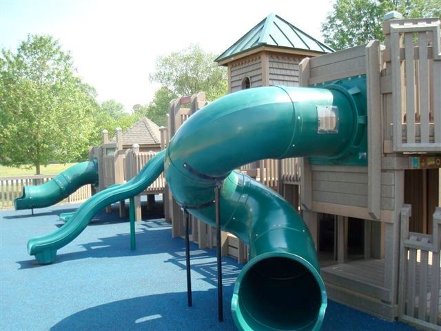 Various Slides Coming off the Side of of Playground Structure